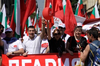 Demonstrators chanting slogans during the Labor Day march through central Sofia